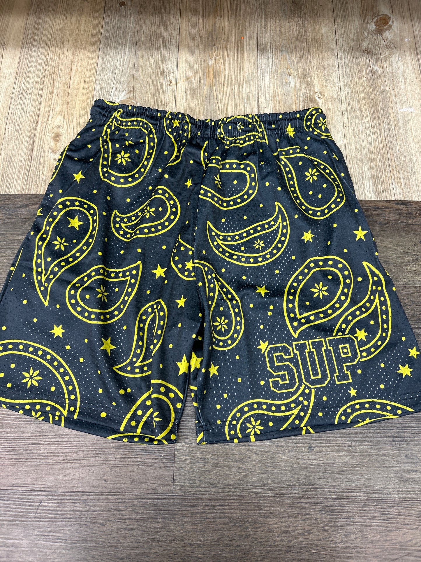 Sup black and yellow shorts